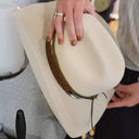 white cowboy hat being hand-shaped with brown bands