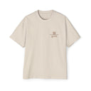 Beige t-shirt with a Gem Hats logo and text on a white background