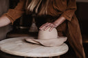 Woman making a hat by hand