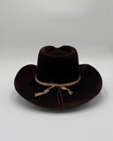 Back view of black wool cowboy hat featuring porcupine quill, suede cord wrap, and upcycled silk band on black felt hat, Gem Hats