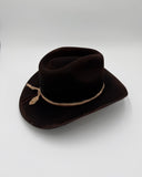 Side profile of black felt cowboy hat with curved brim and two silk hat bands, Gem Hats Denver