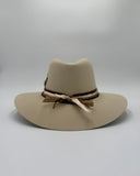 Back detail of leather and silk hat bands and brim on ivory wool felt western hat by Gem Hats