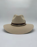 Ivory wool felt western hat with traditional crown, brown and gold decorative bands, and curved brim, hand-shaped by Gem Hats Denver