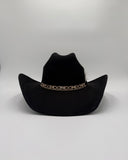 Black suede cowboy hat with classic Western silhouette and gold decorative band, handmade by Gem Hats Denver