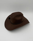 Side profile of dark brown suede cowboy hat with curved brim, Gem Hats Denver