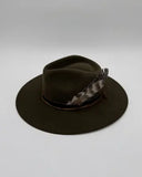 Angled profile of moss green wool felt western hat with two feathers and silk bands, Gem Hats